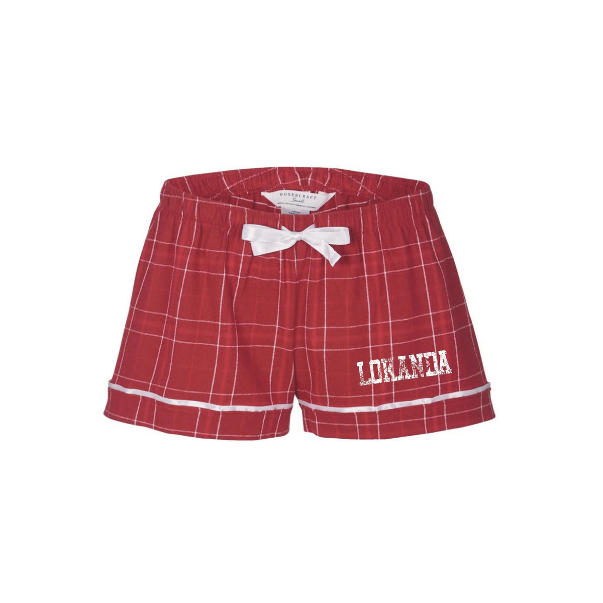 Red plaid pajama shorts with white trim and white bow featuring the text Lokanda