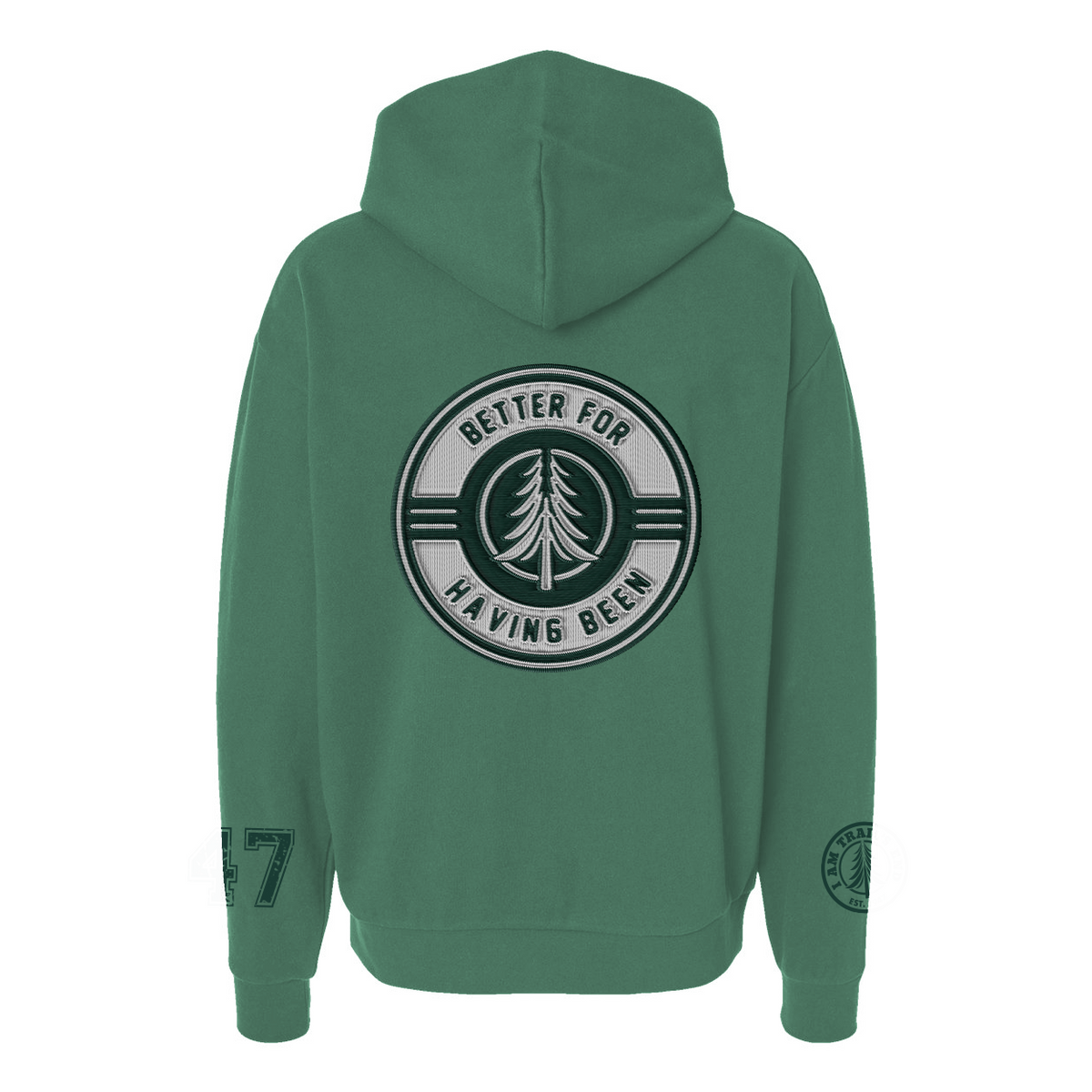 Green hoodie with a circular embroidered patch on the back featuring a pine tree and the text Better For Having Been