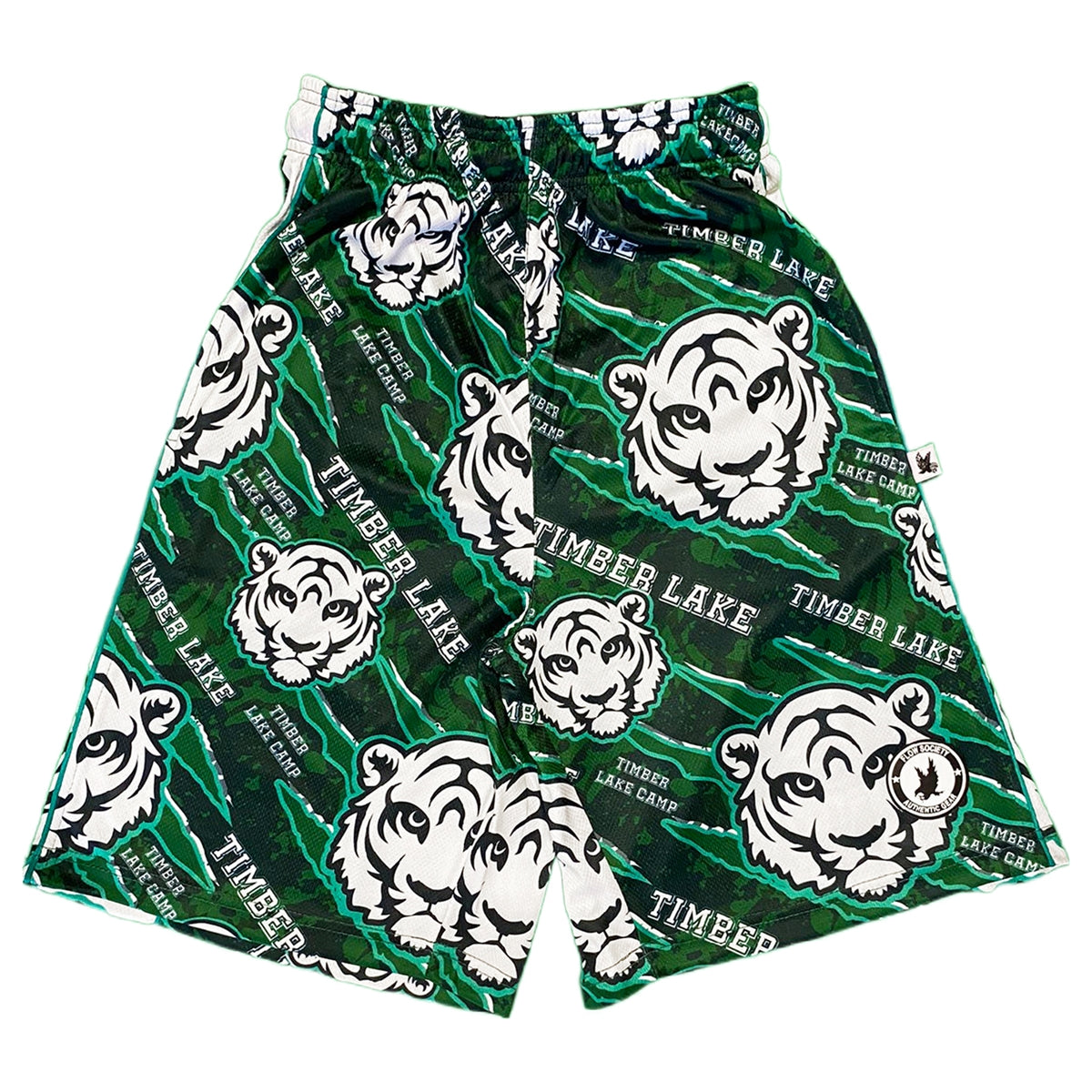 Green athletic shorts with white tiger head print and Timber Lake Camp text