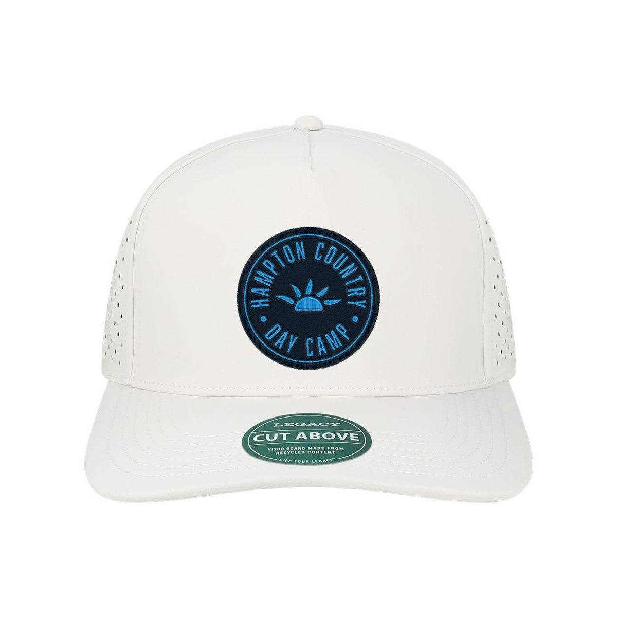 White baseball cap with Hampton Country Day Camp circular patch logo and perforated side panels