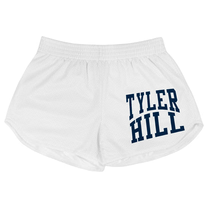 White mesh athletic shorts with Tyler Hill text in navy blue